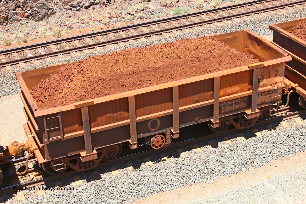 0512 160306 1467
Robe River ore waggon 512, built by Tomlinson Steel WA, fixed coupler handbrake side loaded view, stencil says TEST 3, at the 45 km Harding Siding on the Cape Lambert line. March 6, 2016.
Keywords: 512;Tomlinson-Steel-WA;Robe-ore-waggon;