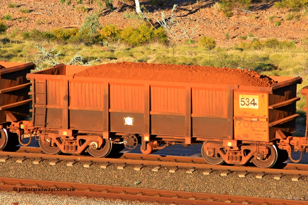 0534 110602 1712
Robe River ore waggon 534, built by Tomlinson Steel WA, rotary coupler end handbrake side loaded view at the 71 km, Western Creek on the Deepdale line. June 2, 2011.
Keywords: 534;Tomlinson-Steel-WA;Robe-ore-waggon;
