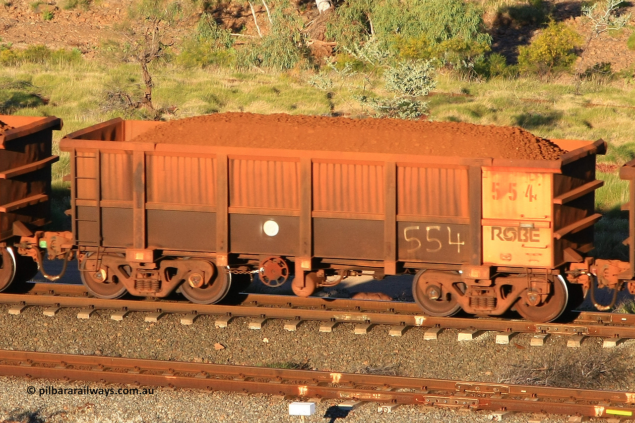 0554 110602 1615
Robe River ore waggon 554, built by Tomlinson Steel WA, rotary coupler end handbrake side loaded view at the 71 km, Western Creek on the Deepdale line. June 2, 2011.
Keywords: 554;Tomlinson-Steel-WA;Robe-ore-waggon;