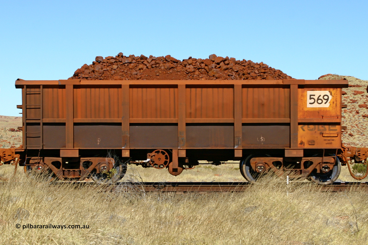 0569 060722 7512
Robe River ore waggon 569, built by Tomlinson Steel WA, handbrake side loaded view at the 78.8 km between Western Creek and Maitland on the Deepdale line. July 22, 2006.
Keywords: 569;Tomlinson-Steel-WA;Robe-ore-waggon;