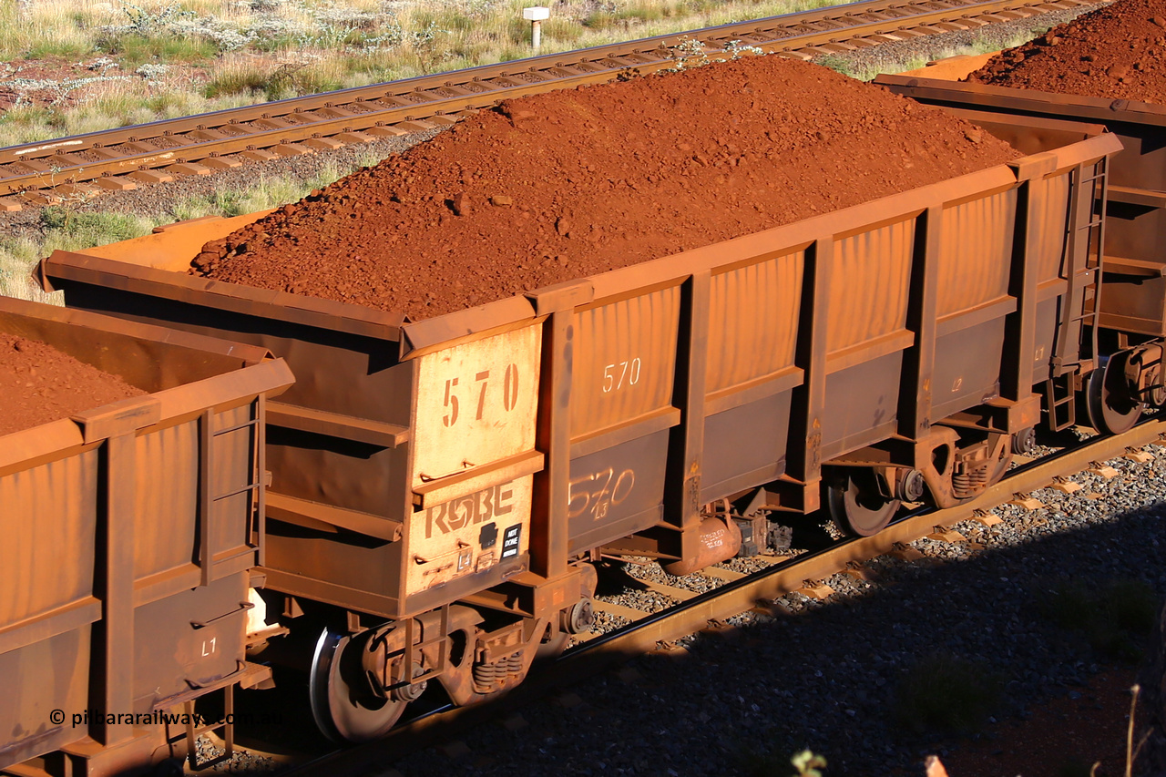 0570 210322 9729
Robe River ore waggon 570, built by Tomlinson Steel WA, rotary coupler end non-handbrake side loaded view at the 17 km on the Cape Lambert line, March 22, 2021.
Keywords: 570;Tomlinson-Steel-WA;Robe-ore-waggon;