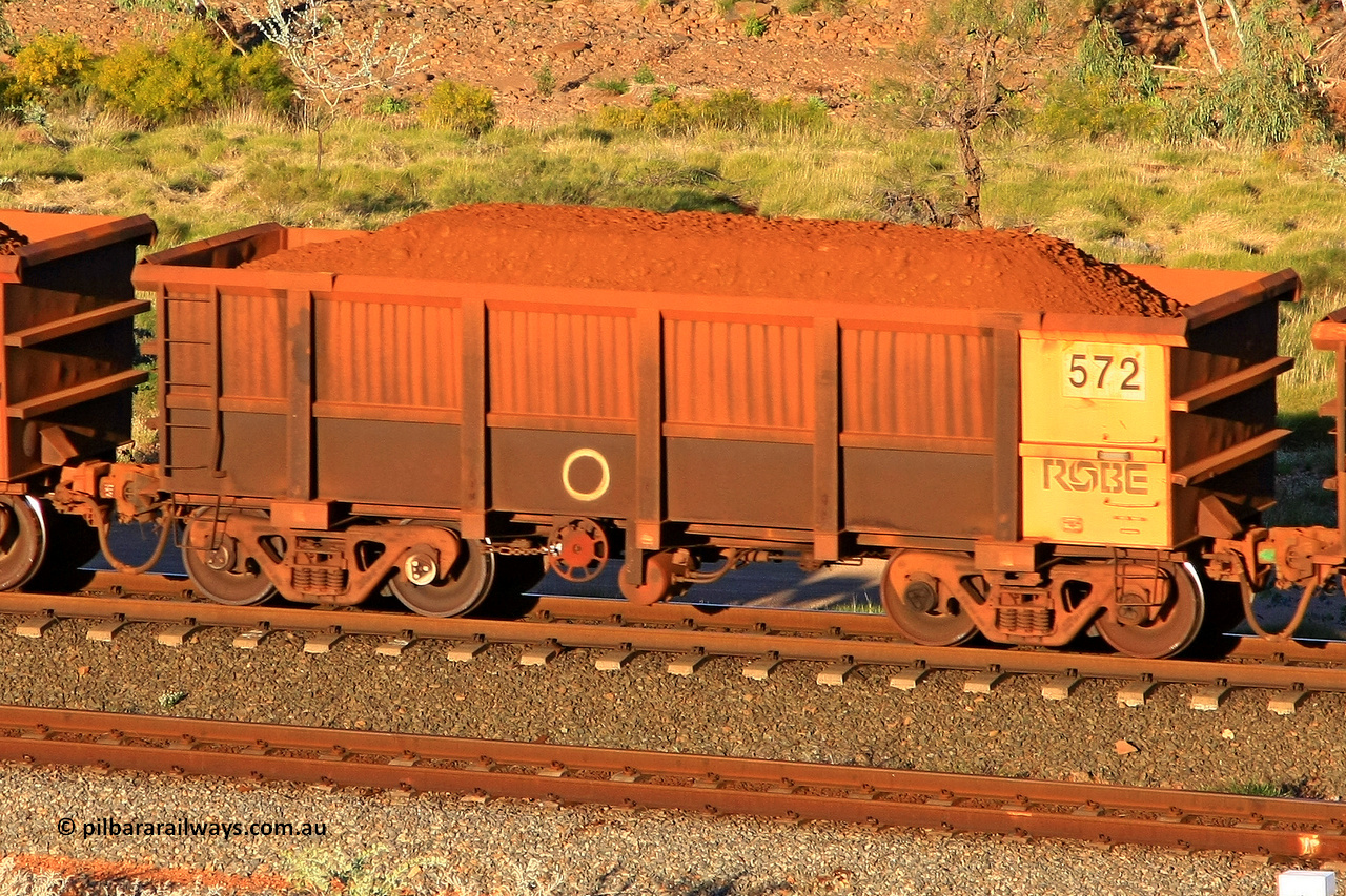 0572 110602 1688
Robe River ore waggon 572, built by Tomlinson Steel WA, rotary coupler end handbrake side loaded view at the 71 km, Western Creek on the Deepdale line. June 2, 2011.
Keywords: 572;Tomlinson-Steel-WA;Robe-ore-waggon;