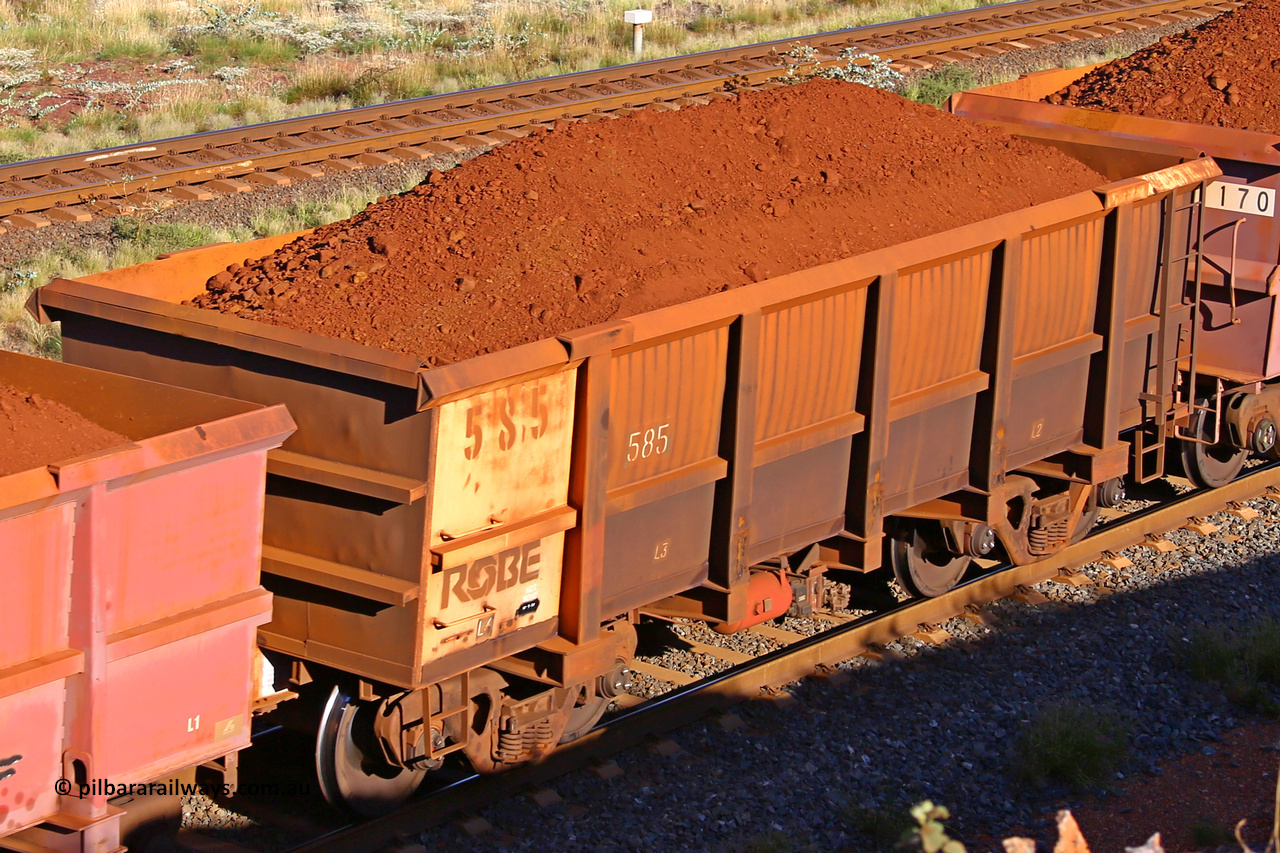 0585 210322 9763
Robe River ore waggon 585, built by Tomlinson Steel WA, rotary coupler end non-handbrake side loaded view at the 17 km on the Cape Lambert line, March 22, 2021.
Keywords: 585;Tomlinson-Steel-WA;Robe-ore-waggon;