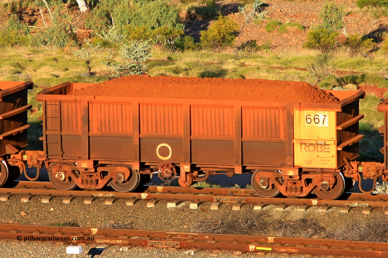 0667 110602 1668
Robe River ore waggon 667, built by Tomlinson Steel WA, rotary coupler end handbrake side loaded view at the 71 km, Western Creek on the Deepdale line. June 2, 2011.
Keywords: 667;Tomlinson-Steel-WA;Robe-ore-waggon;