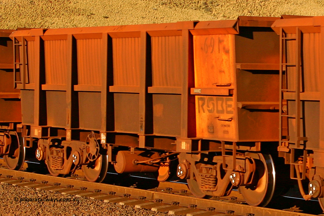 0691 060722 7607
Robe River ore waggon 691, built by Tomlinson Steel WA, rotary coupler end handbrake side empty view, at the 11.7 km, Cape Lambert. July 22, 2006.
Keywords: 691;Tomlinson-Steel-WA;Robe-ore-waggon;