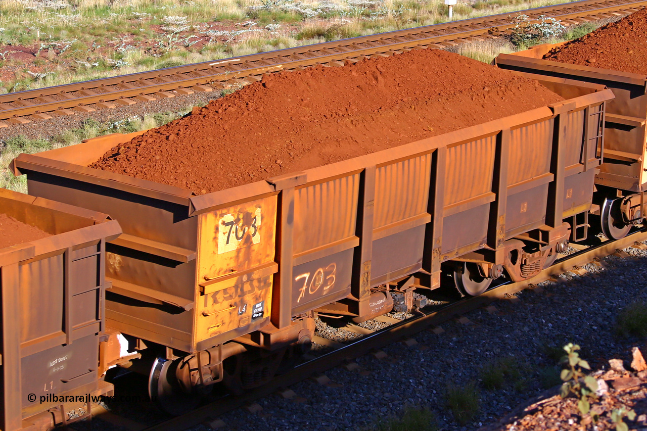 0703 210322 9769
Robe River ore waggon 703, built by Tomlinson Steel WA, rotary coupler end non-handbrake side loaded view at the 17 km on the Cape Lambert line, March 22, 2021.
Keywords: 703;Tomlinson-Steel-WA;Robe-ore-waggon;