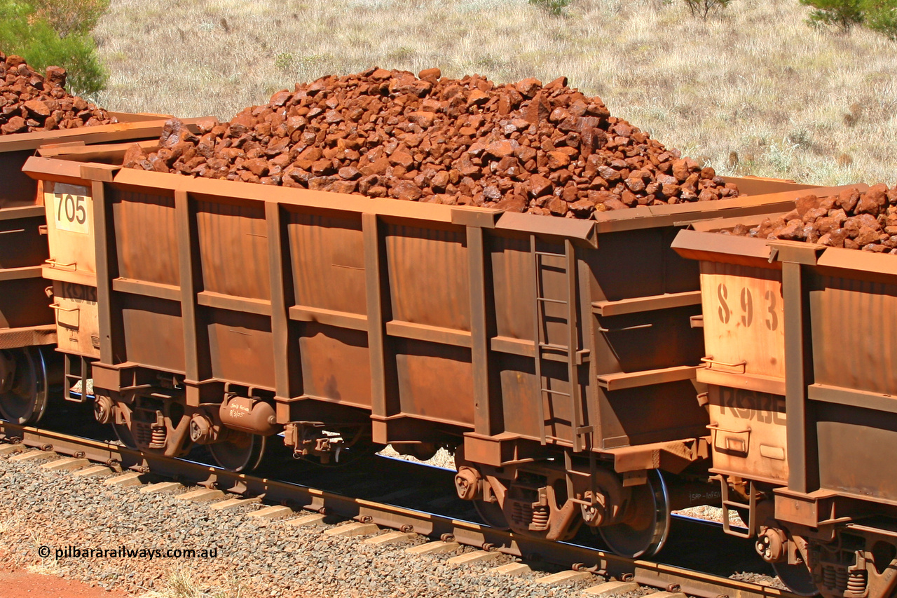 0705 061209 8177
Robe River ore waggon 705, built by Tomlinson Steel WA, fixed coupler non-handbrake side loaded view at the 7 km location just south of Cape Lambert yard. December 9, 2006.
Keywords: 705;Tomlinson-Steel-WA;Robe-ore-waggon;