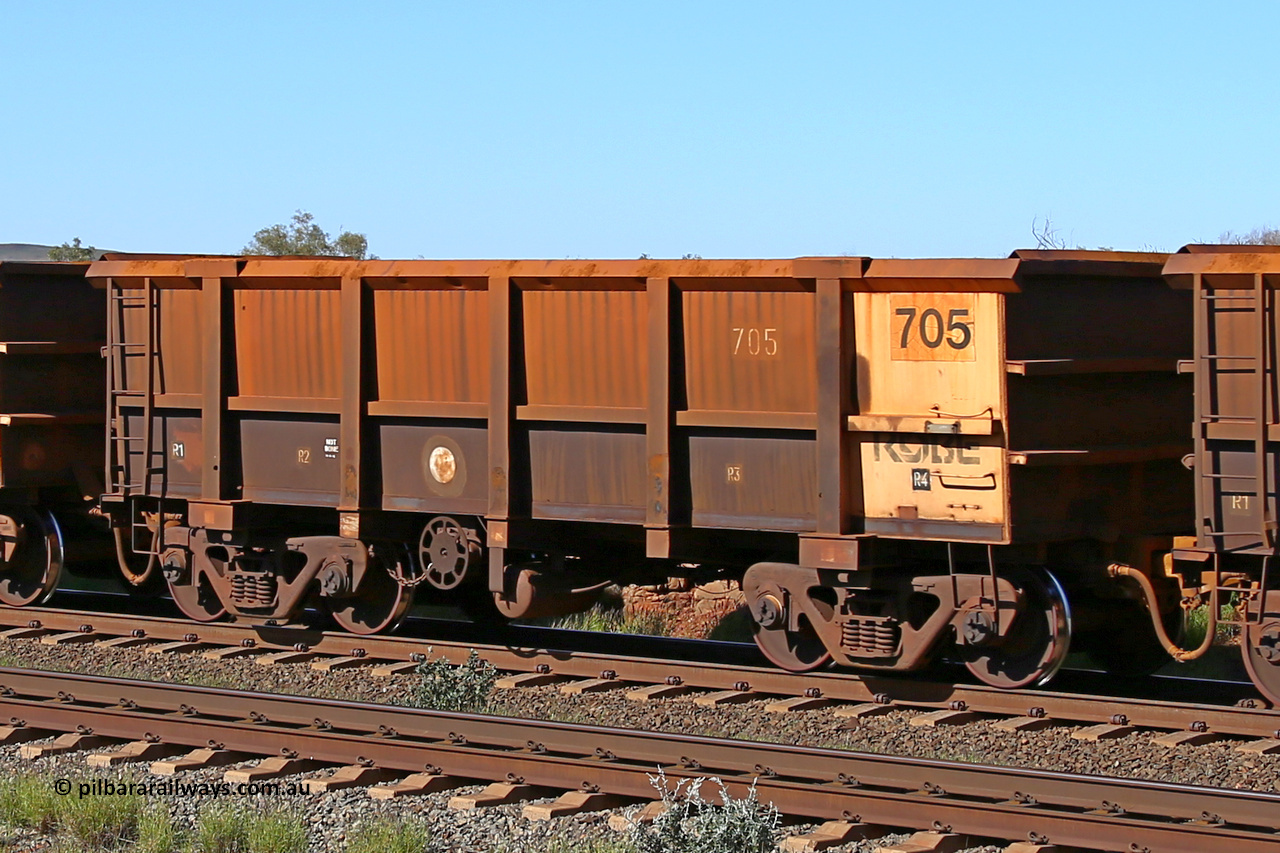 0705 160727 0965
Robe River ore waggon 705, built by Tomlinson Steel WA, rotary coupler end handbrake side empty view at Harding Siding on the Cape Lambert line, July 27, 2016.
Keywords: 705;Tomlinson-Steel-WA;Robe-ore-waggon;