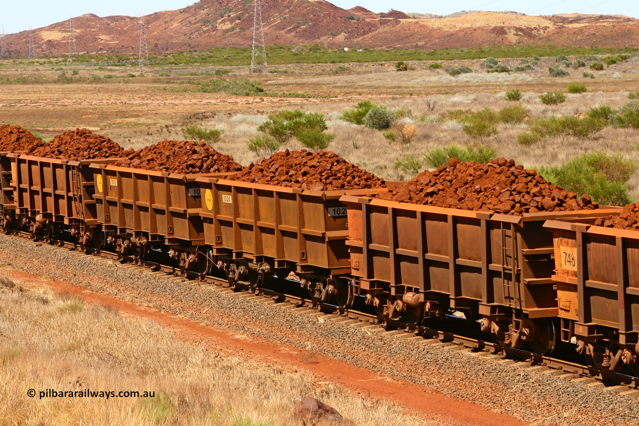 0711 061209 8187
Robe River ore waggon 711, built by Tomlinson Steel WA, fixed coupler non-handbrake side loaded view, along with two new Bradken builds, at the 7 km location just south of Cape Lambert yard. December 9, 2006.
Keywords: 711;Tomlinson-Steel-WA;Robe-ore-waggon;
