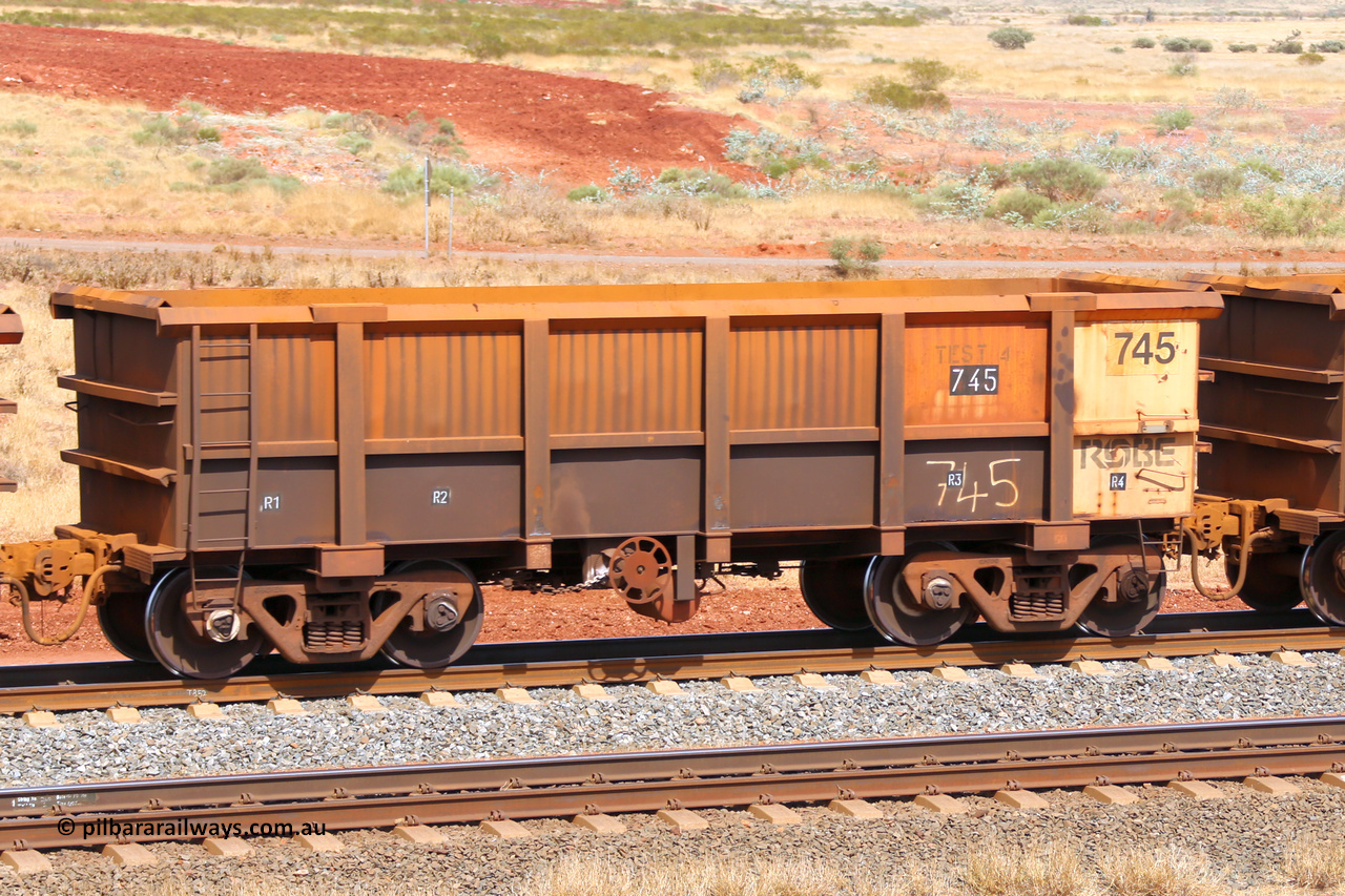 0745 141124 6801
Robe River ore waggon 745, built by Tomlinson Steel WA, fixed coupler handbrake side empty view, stencil says TEST 4, at the 25 km at Arches Siding on the Cape Lambert line. November 24, 2014.
Keywords: 745;Tomlinson-Steel-WA;Robe-ore-waggon;