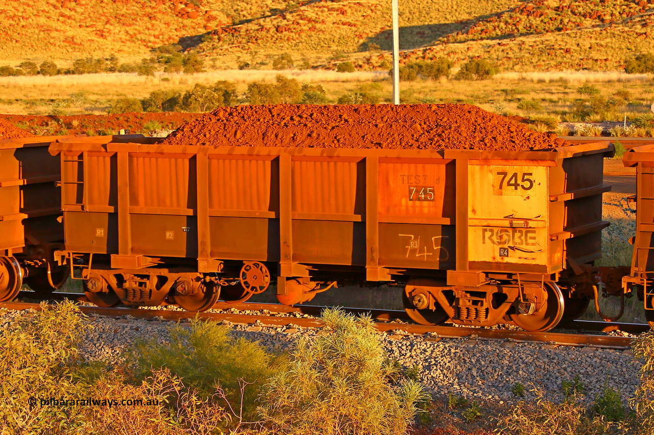 0745 170513 8625
Robe River ore waggon 745, built by Tomlinson Steel WA, rotary coupler end handbrake side loaded view, stencil says TEST 4, Cape Lambert yard, May 13, 2017.
Keywords: 745;Tomlinson-Steel-WA;Robe-ore-waggon;