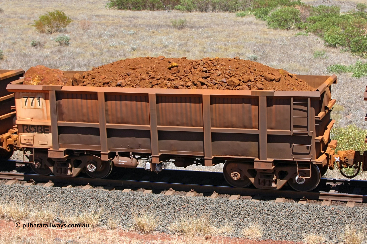 0771 081209 0170
Robe River ore waggon 771, built by Centurion Industries WA, fixed coupler non-handbrake side loaded view at the 7 km location just south of Cape Lambert yard. December 9, 2008.
Keywords: 771;Centurion-Industries-WA;Robe-ore-waggon;