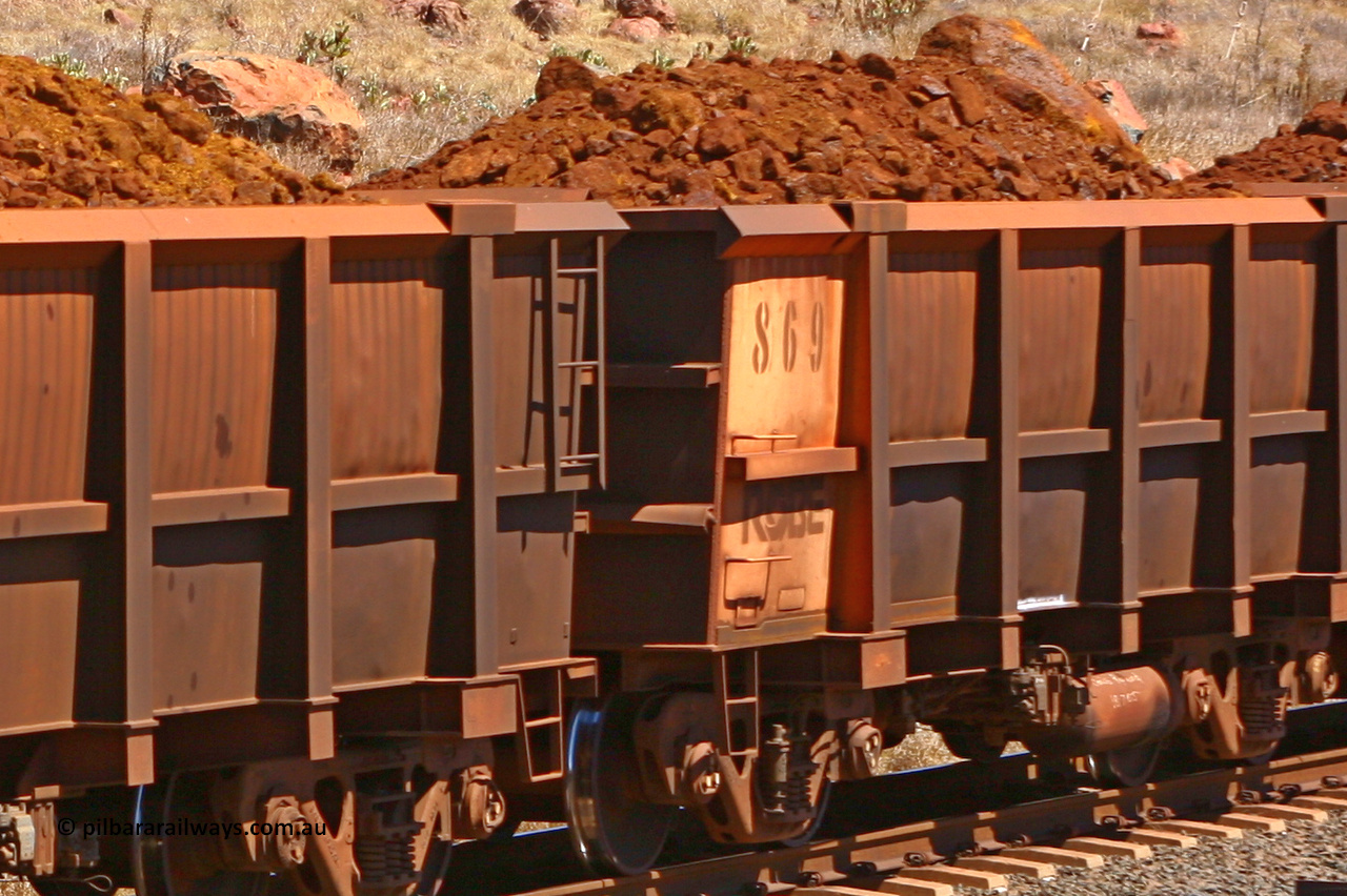 0869 061209 8194
Robe River ore waggon 869, built by Centurion Industries WA, rotary coupler end non-handbrake side loaded partial view at the entrance of Cape Lambert yard. December 9, 2006.
Keywords: 869;Centurion-Industries-WA;Robe-ore-waggon;