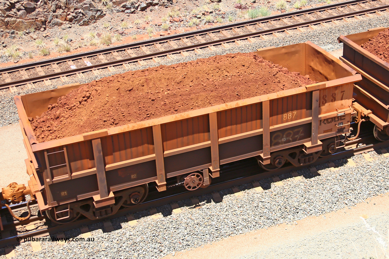 0887 160306 1466
Robe River ore waggon 887, built by Centurion Industries WA, fixed coupler handbrake side loaded view, at the 45 km, Harding Siding on the Cape Lambert line. March 6, 2016.
Keywords: 887;Centurion-Industries-WA;Robe-ore-waggon;