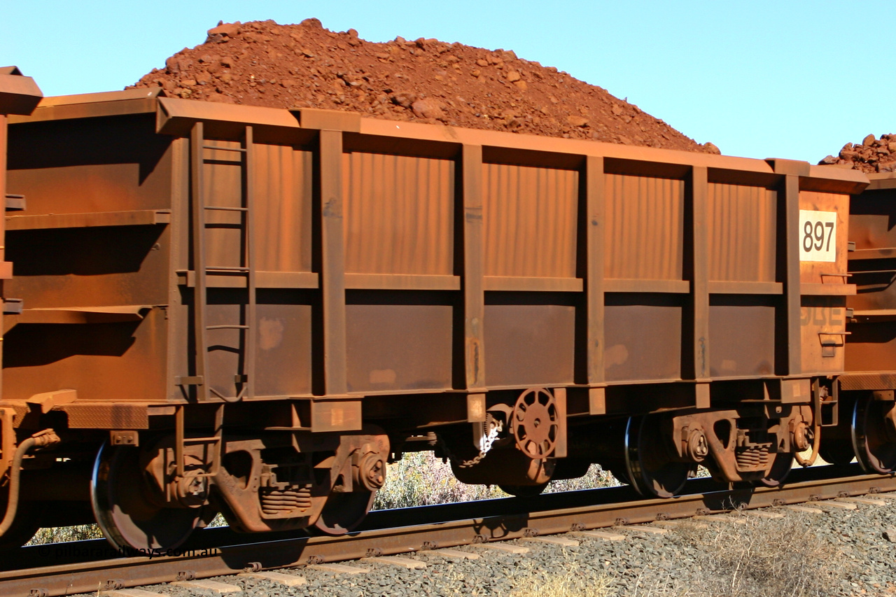 0897 060716 7187
Robe River ore waggon 897, built by Centurion Industries WA, fixed coupler end handbrake side loaded. Western Creek, July 16, 2006.
Keywords: 897;Centurion-Industries-WA;Robe-ore-waggon;