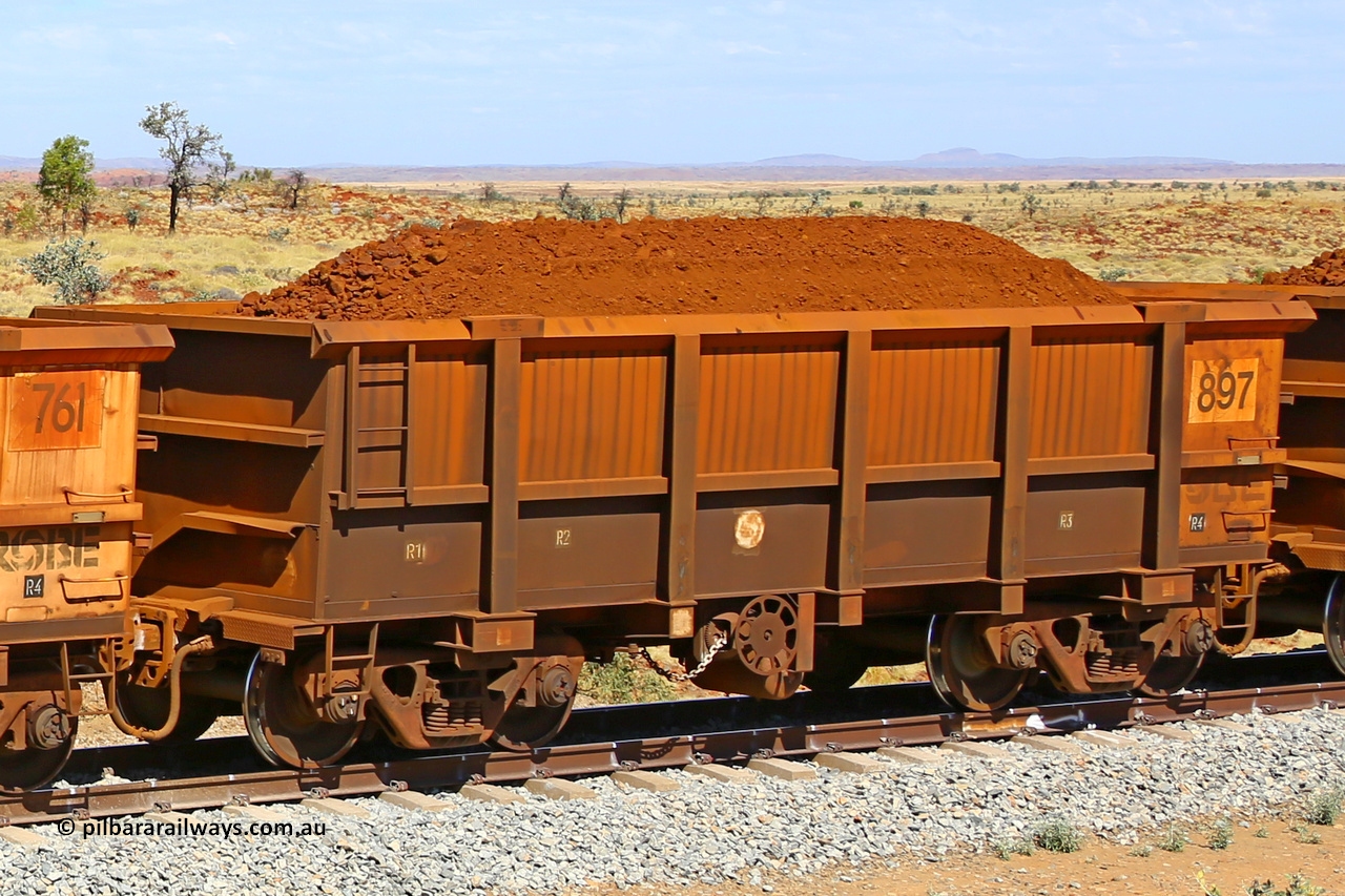 0897 170729 0254
Robe River ore waggon 897, built by Centurion Industries WA, fixed coupler handbrake side loaded view at the 103 km, between Maitland Siding and the Fortescue River on the Deepdale line. July 29, 2017.
Keywords: 897;Centurion-Industries-WA;Robe-ore-waggon;