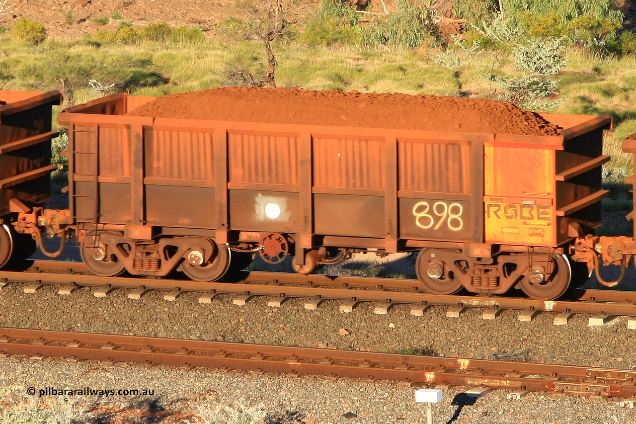 0898 110602 1611
Robe River ore waggon 898, built by Centurion Industries WA, rotary coupler end handbrake side loaded view at the 71 km, Western Creek on the Deepdale line. June 2, 2011.
Keywords: 898;Centurion-Industries-WA;Robe-ore-waggon;
