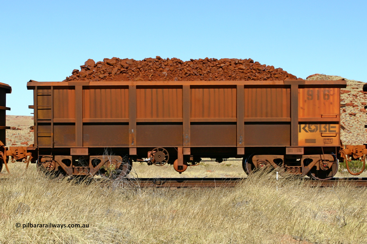 0916 060722 7527
Robe River ore waggon 916, built by Centurion Industries WA, handbrake side loaded view at the 78.8 km between Western Creek and Maitland on the Deepdale line. July 22, 2006.
Keywords: 916;Centurion-Industries-WA;Robe-ore-waggon;