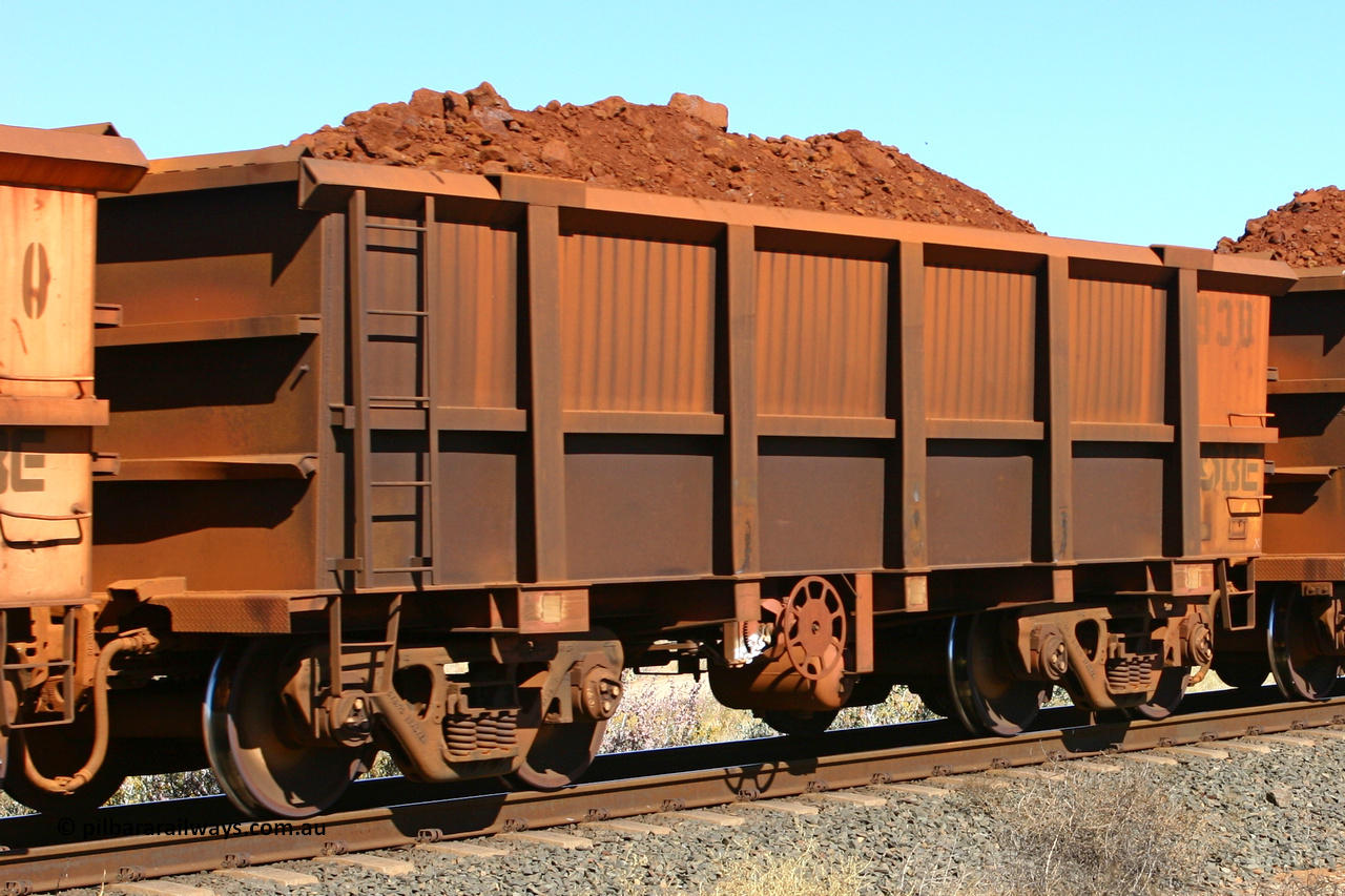 0938 060716 7186
Robe River ore waggon 938, built by Centurion Industries WA, fixed coupler end handbrake side loaded. Western Creek, July 16, 2006.
Keywords: 938;Centurion-Industries-WA;Robe-ore-waggon;