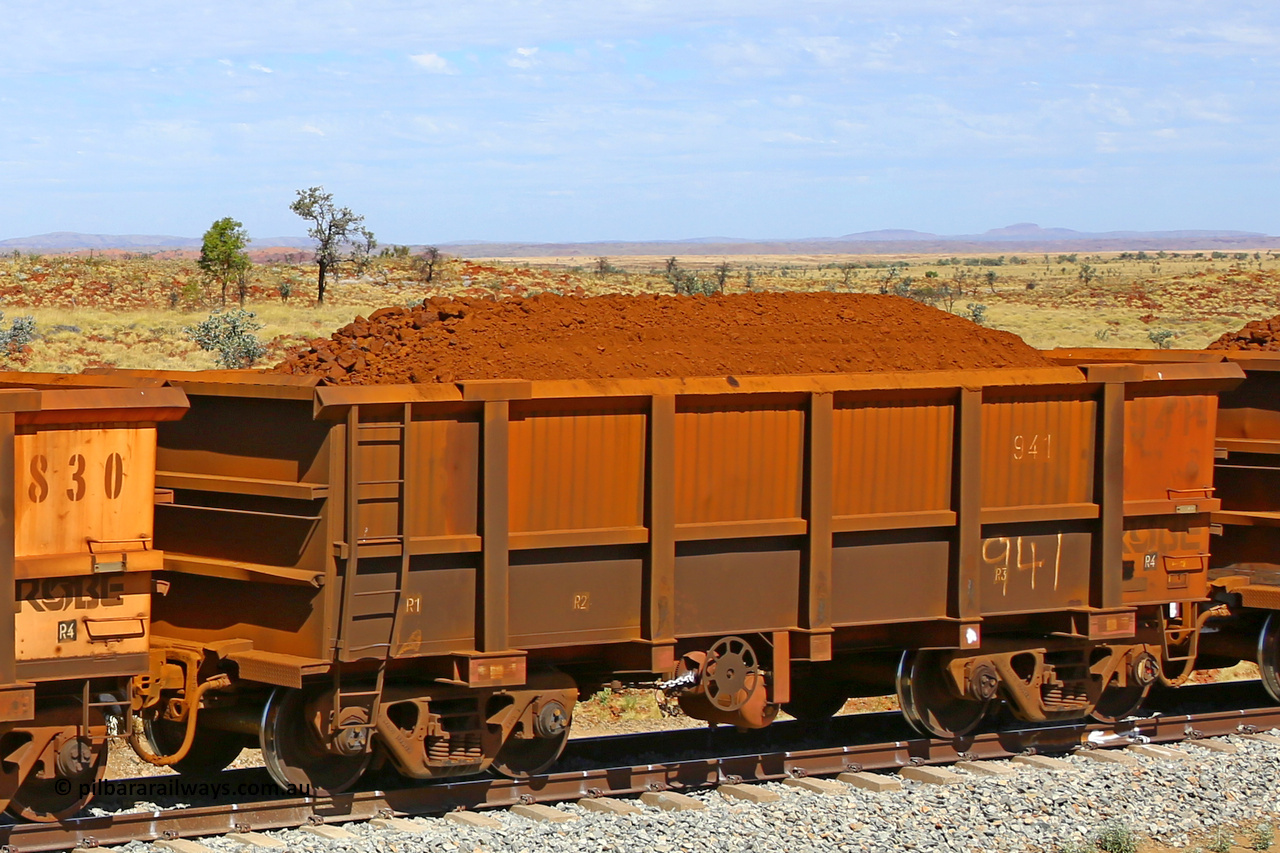 0941 170729 0274
Robe River ore waggon 941, built by Centurion Industries WA, fixed coupler handbrake side loaded view at the 103 km, between Maitland Siding and the Fortescue River on the Deepdale line. July 29, 2017.
Keywords: 941;Centurion-Industries-WA;Robe-ore-waggon;