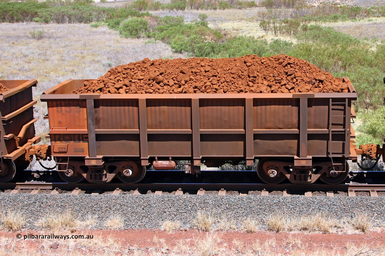 0959 081209 0142
Robe River ore waggon 959, built by Centurion Industries WA, non-handbrake side loaded view at the 7 km location just south of Cape Lambert yard. December 9, 2008.
Keywords: 959;Centurion-Industries-WA;Robe-ore-waggon;