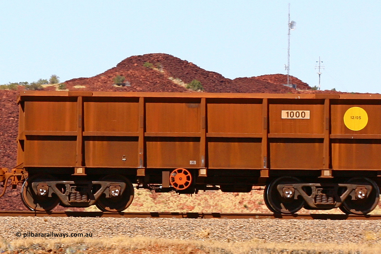 1000 060722 7436
Robe River ore waggon 1000, class leader built by Bradken Rail Qld in December 2005, fixed coupler handbrake side empty, partial, view at the 45.4 km just south of Harding Siding on the Cape Lambert line. July 22, 2006.
Keywords: 1000;Bradken-Rail-Qld;Robe-ore-waggon;