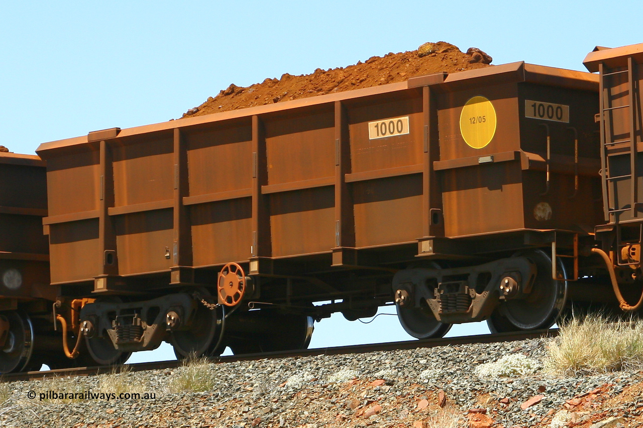 1000 070916 0996
Robe River ore waggon 1000, class leader built by Bradken Rail Qld in December 2005, rotary coupler end handbrake side loaded view, at the 72 km Western Creek on the Deepdale line. September 16, 2007.
Keywords: 1000;Bradken-Rail-Qld;Robe-ore-waggon;