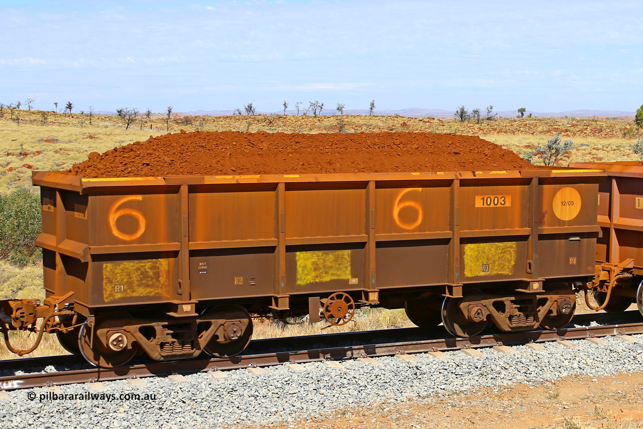 1003 170729 0250
Robe River ore waggon 1003, built by Bradken Rail Qld in December 2005, fixed coupler handbrake side loaded view at the 103 km, between Maitland Siding and the Fortescue River on the Deepdale line. July 29, 2017.
Keywords: 1003;Bradken-Rail-Qld;Robe-ore-waggon;
