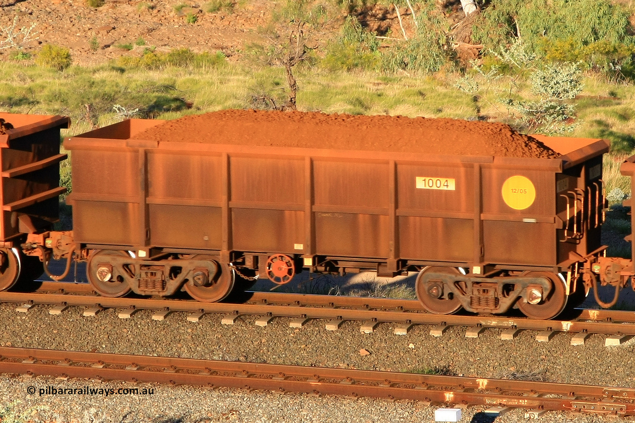 1004 110602 1609
Robe River ore waggon 1004, built by Bradken Rail Qld in December 2005, rotary coupler end handbrake side loaded view at the 71 km, Western Creek on the Deepdale line. June 2, 2011.
Keywords: 1004;Bradken-Rail-Qld;Robe-ore-waggon;