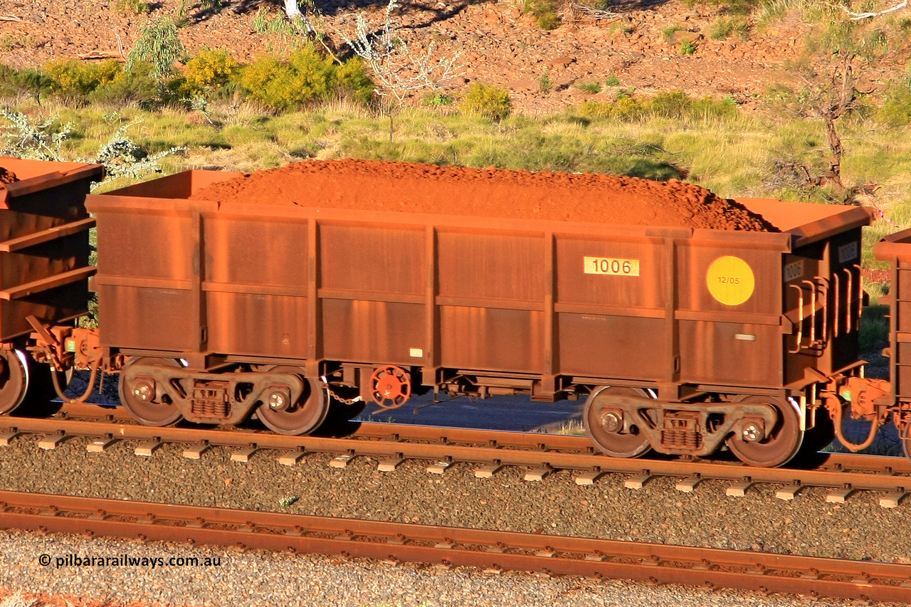 1006 110602 1699
Robe River ore waggon 1006, built by Bradken Rail Qld in December 2005, rotary coupler end handbrake side loaded view at the 71 km, Western Creek on the Deepdale line. June 2, 2011.
Keywords: 1006;Bradken-Rail-Qld;Robe-ore-waggon;