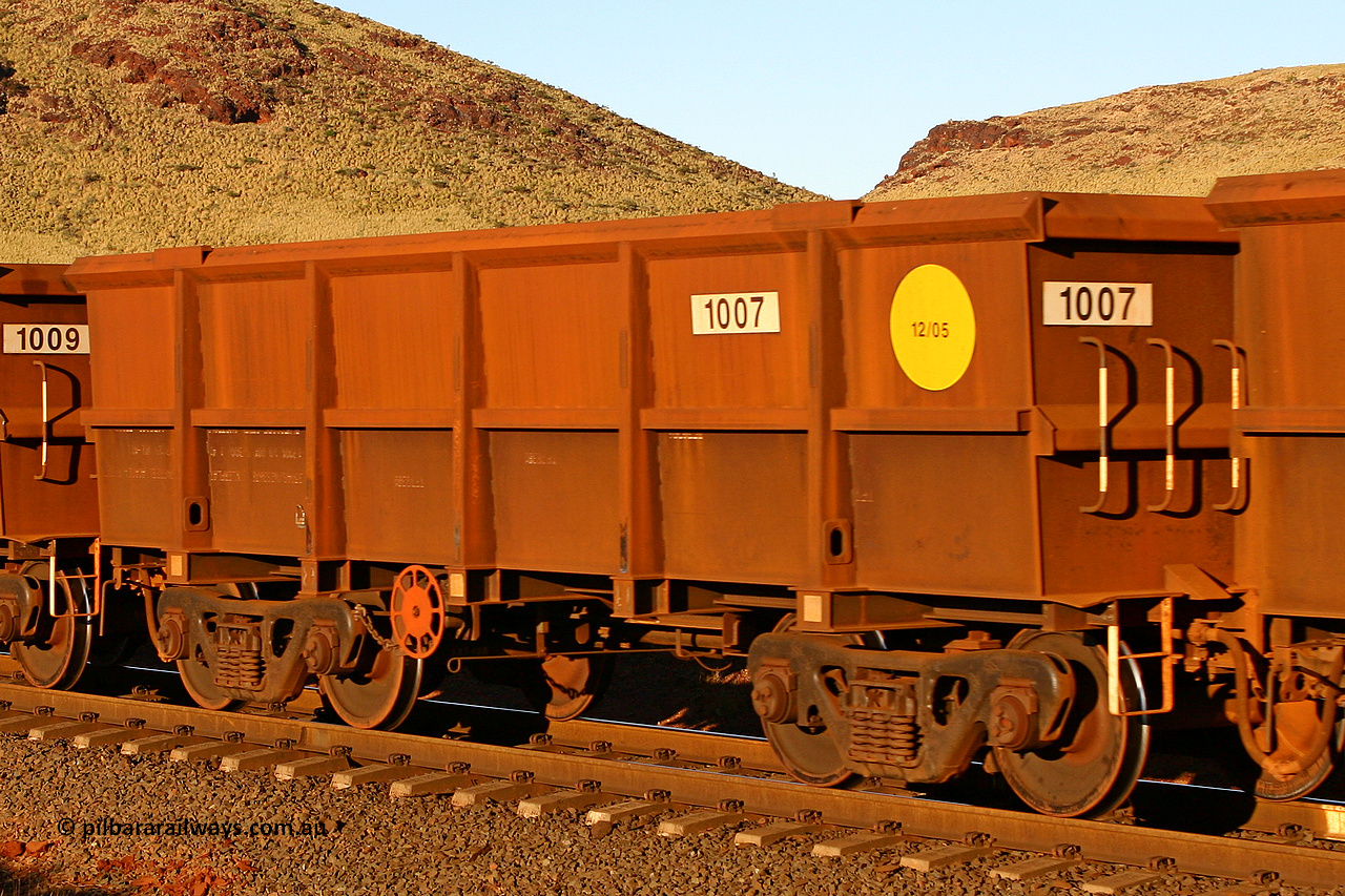 1007 060722 7599
Robe River ore waggon 1007, built by Bradken Rail Qld in December 2005, rotary coupler end handbrake side empty view, at the 11.7 km, Cape Lambert. July 22, 2006.
Keywords: 1007;Bradken-Rail-Qld;Robe-ore-waggon;