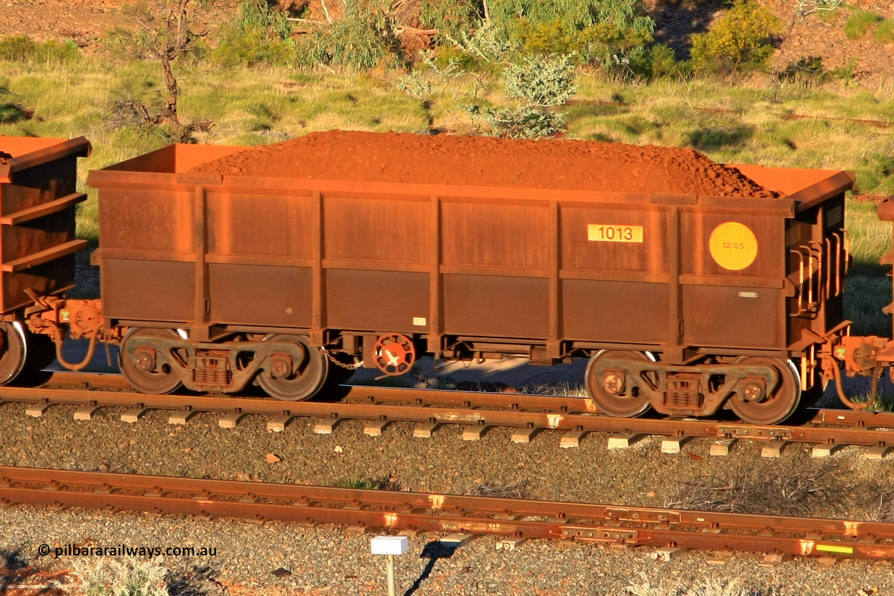 1013 110602 1633
Robe River ore waggon 1013, built by Bradken Rail Qld in December 2005, rotary coupler end handbrake side loaded view at the 71 km, Western Creek on the Deepdale line. June 2, 2011.
Keywords: 1013;Bradken-Rail-Qld;Robe-ore-waggon;