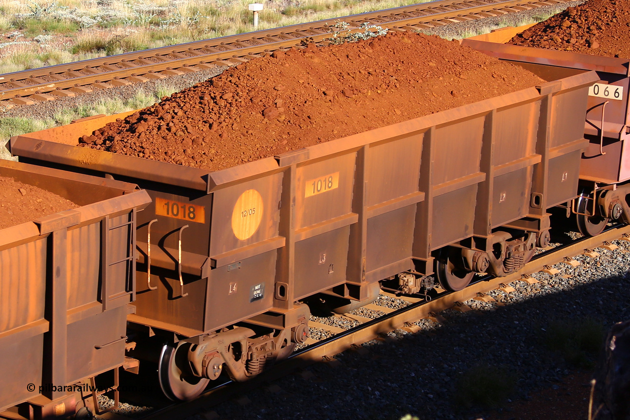 1018 210322 9792
Robe River ore waggon 1018, built by Bradken Rail Qld in December 2005, rotary coupler end non-handbrake side loaded view, at the 17 km on the Cape Lambert line, March 22, 2021.
Keywords: 1018;Bradken-Rail-Qld;Robe-ore-waggon;