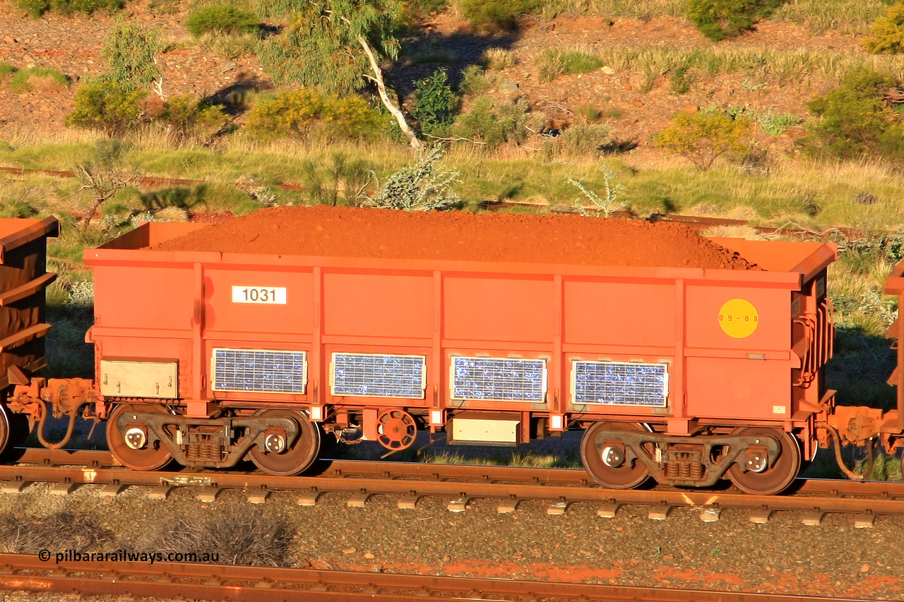 1031 110602 1662
Robe River ore waggon 1031, built by Bradken Rail Qld in September 2008, rotary coupler end handbrake side loaded view, instrumented vehicle, at the 71 km, Western Creek on the Deepdale line. June 2, 2011.
Keywords: 1031;Bradken-Rail-Qld;Robe-ore-waggon;