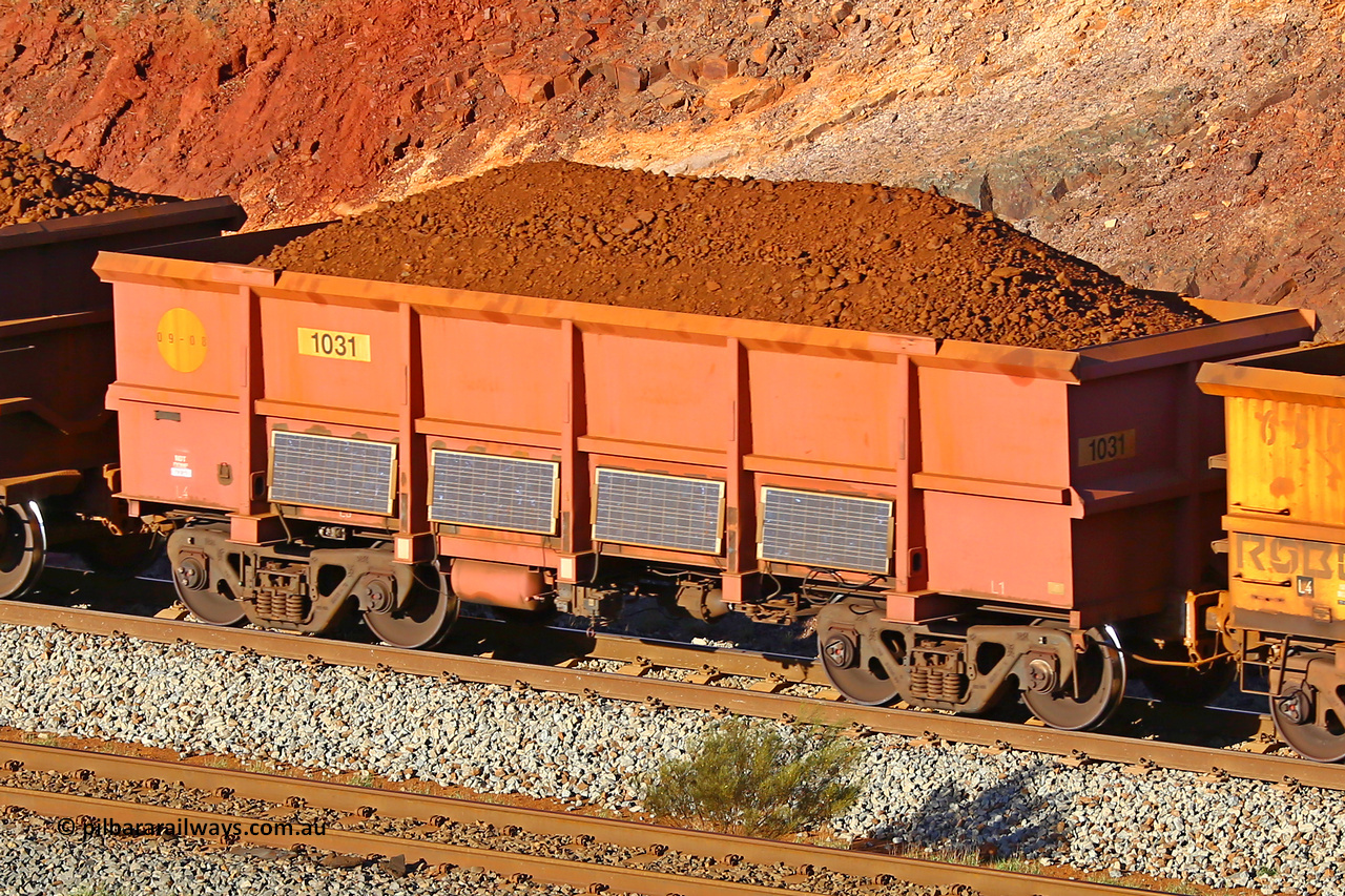 1031 180616 1649
Robe River ore waggon 1031, built by Bradken Rail Qld in January 2006, fixed coupler non-handbrake side loaded view, instrumented vehicle, at the 38 km, Harding  on the Cape Lambert line, June 16, 2018.
Keywords: 1031;Bradken-Rail-Qld;Robe-ore-waggon;