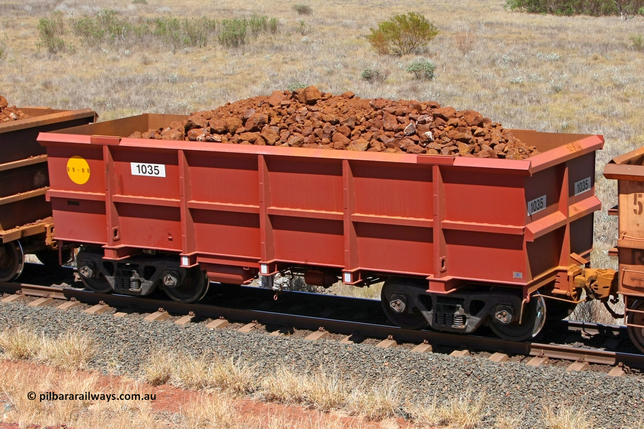 1035 081209 0165
Robe River ore waggon 1035, built by Bradken Rail Qld in September 2008, fixed coupler non-handbrake side loaded view at the 7 km location just south of Cape Lambert yard. December 9, 2008.
Keywords: 1035;Bradken-Rail-Qld;Robe-ore-waggon;