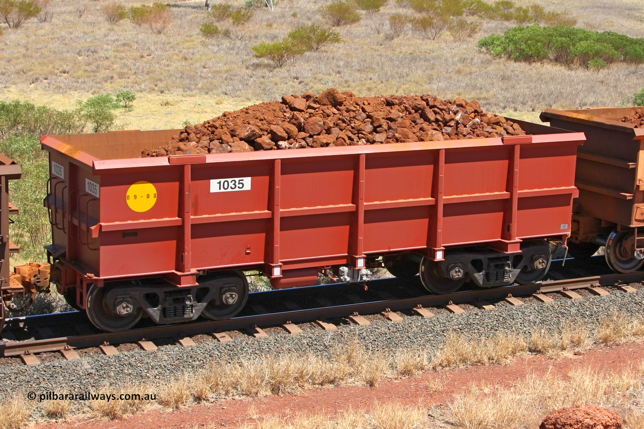 1035 081209 0166
Robe River ore waggon 1035, built by Bradken Rail Qld in September 2008, rotary coupler end non-handbrake side loaded view at the 7 km location just south of Cape Lambert yard. December 9, 2008.
Keywords: 1035;Bradken-Rail-Qld;Robe-ore-waggon;