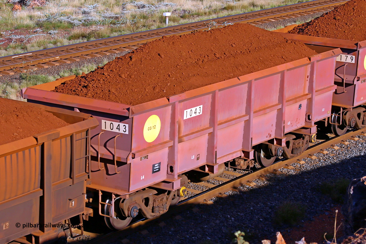 1043 210322 9697
Robe River ore waggon 1043, built by Bradken Rail Qld in March 2012, rotary coupler end non-handbrake side loaded view, at the 17 km on the Cape Lambert line, March 22, 2021.
Keywords: 1043;Bradken-Rail-Qld;Robe-ore-waggon;