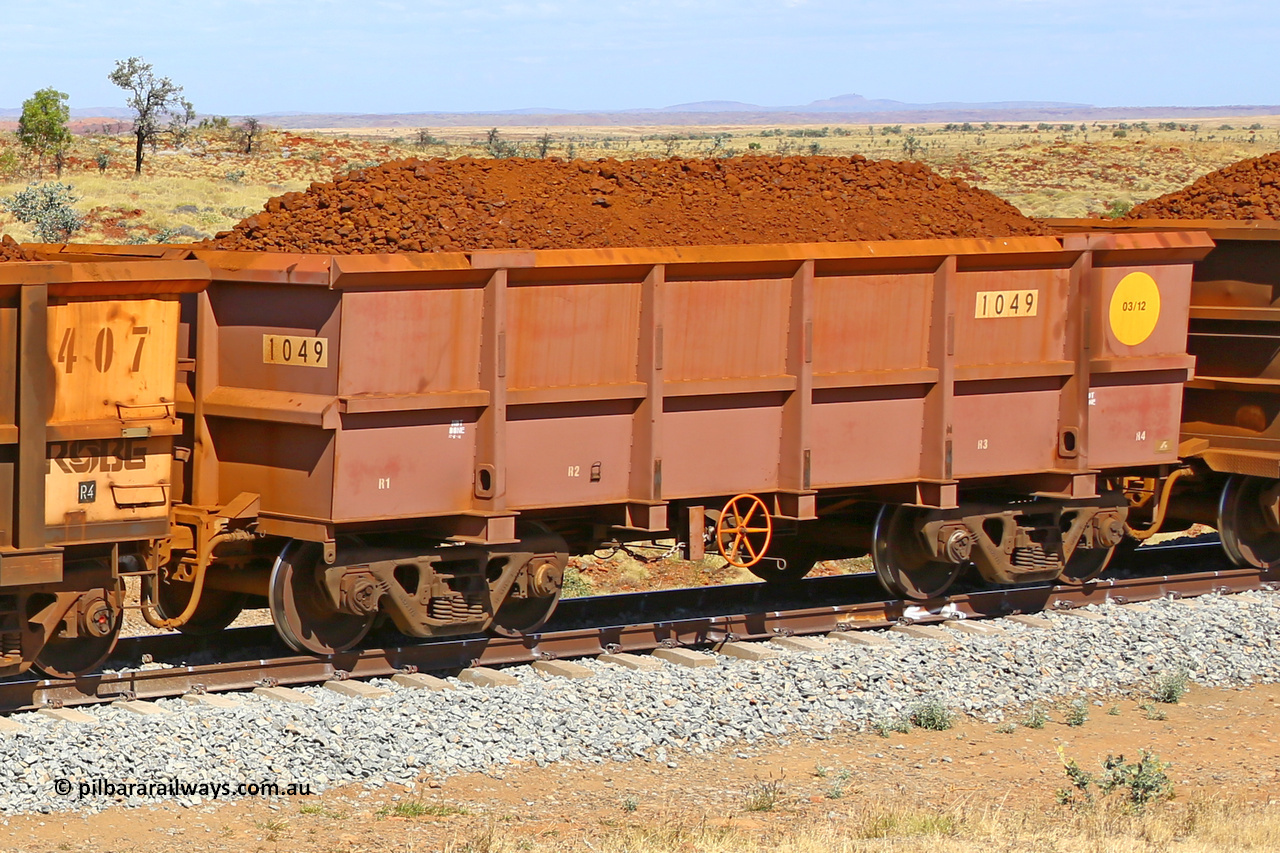 1049 170729 0202
Robe River ore waggon 1049, built by Bradken Rail Qld in March 2012, fixed coupler handbrake side loaded view at the 103 km, between Maitland Siding and the Fortescue River on the Deepdale line. July 29, 2017.
Keywords: 1049;Bradken-Rail-Qld;Robe-ore-waggon;