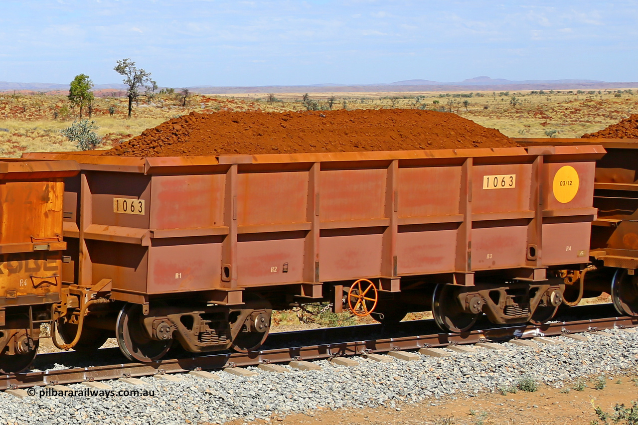 1063 170729 0265
Robe River ore waggon 1063, built by Bradken Rail Qld in March 2012, fixed coupler handbrake side loaded view at the 103 km, between Maitland Siding and the Fortescue River on the Deepdale line. July 29, 2017.
Keywords: 1063;Bradken-Rail-Qld;Robe-ore-waggon;