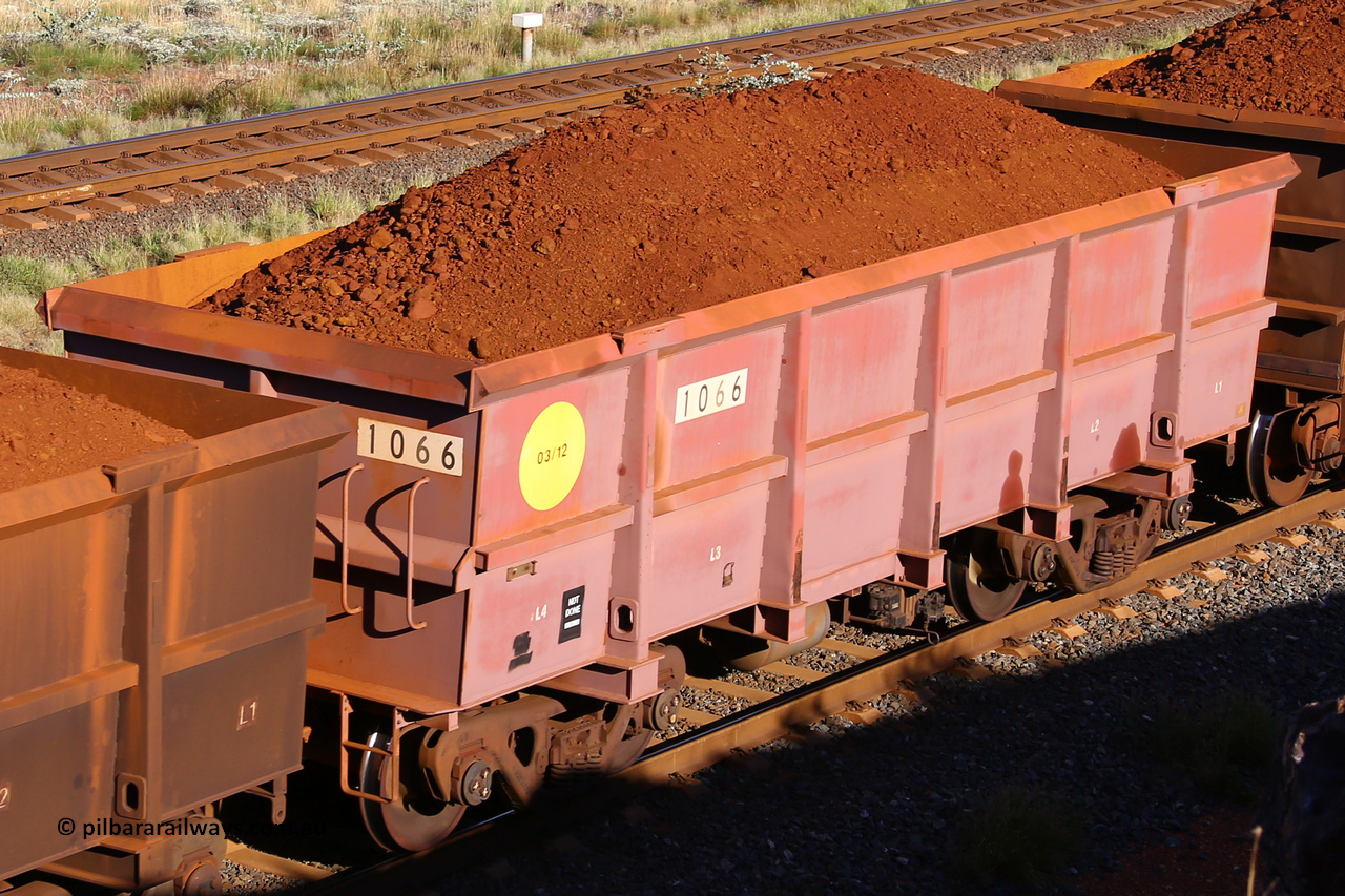 1066 210322 9793
Robe River ore waggon 1066, built by Bradken Rail Qld in March 2012, rotary coupler end non-handbrake side loaded view, at the 17 km on the Cape Lambert line, March 22, 2021.
Keywords: 1066;Bradken-Rail-Qld;Robe-ore-waggon;