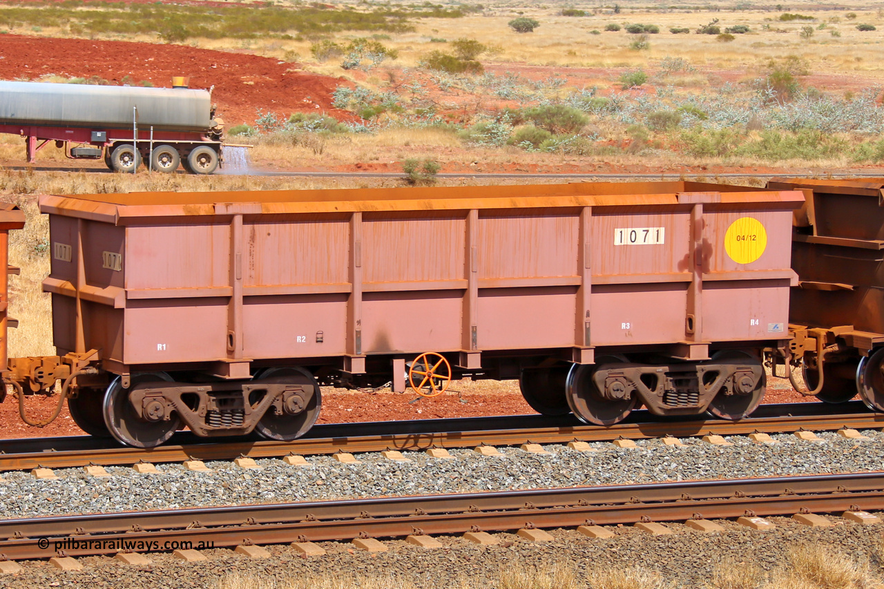 1071 141124 6822
Robe River ore waggon 1071, built by Bradken Rail Qld in April 2012, fixed coupler handbrake side empty view at the 25 km at Arches Siding on the Cape Lambert line. November 24, 2014.
Keywords: 1071;Bradken-Rail-Qld;Robe-ore-waggon;