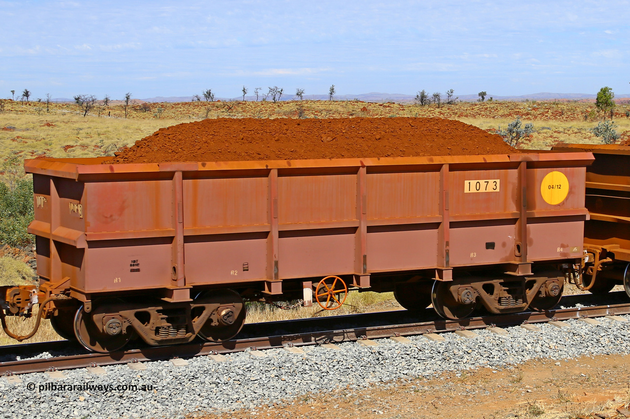 1073 170729 0251
Robe River ore waggon 1073, built by Bradken Rail Qld in April 2012, fixed coupler handbrake side loaded view at the 103 km, between Maitland Siding and the Fortescue River on the Deepdale line. July 29, 2017.
Keywords: 1073;Bradken-Rail-Qld;Robe-ore-waggon;