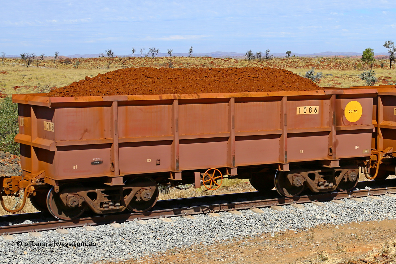 1086 170729 0215
Robe River ore waggon 1086, built by Bradken Rail Qld in May 2012, fixed coupler handbrake side loaded view at the 103 km, between Maitland Siding and the Fortescue River on the Deepdale line. July 29, 2017.
Keywords: 1086;Bradken-Rail-Qld;Robe-ore-waggon;