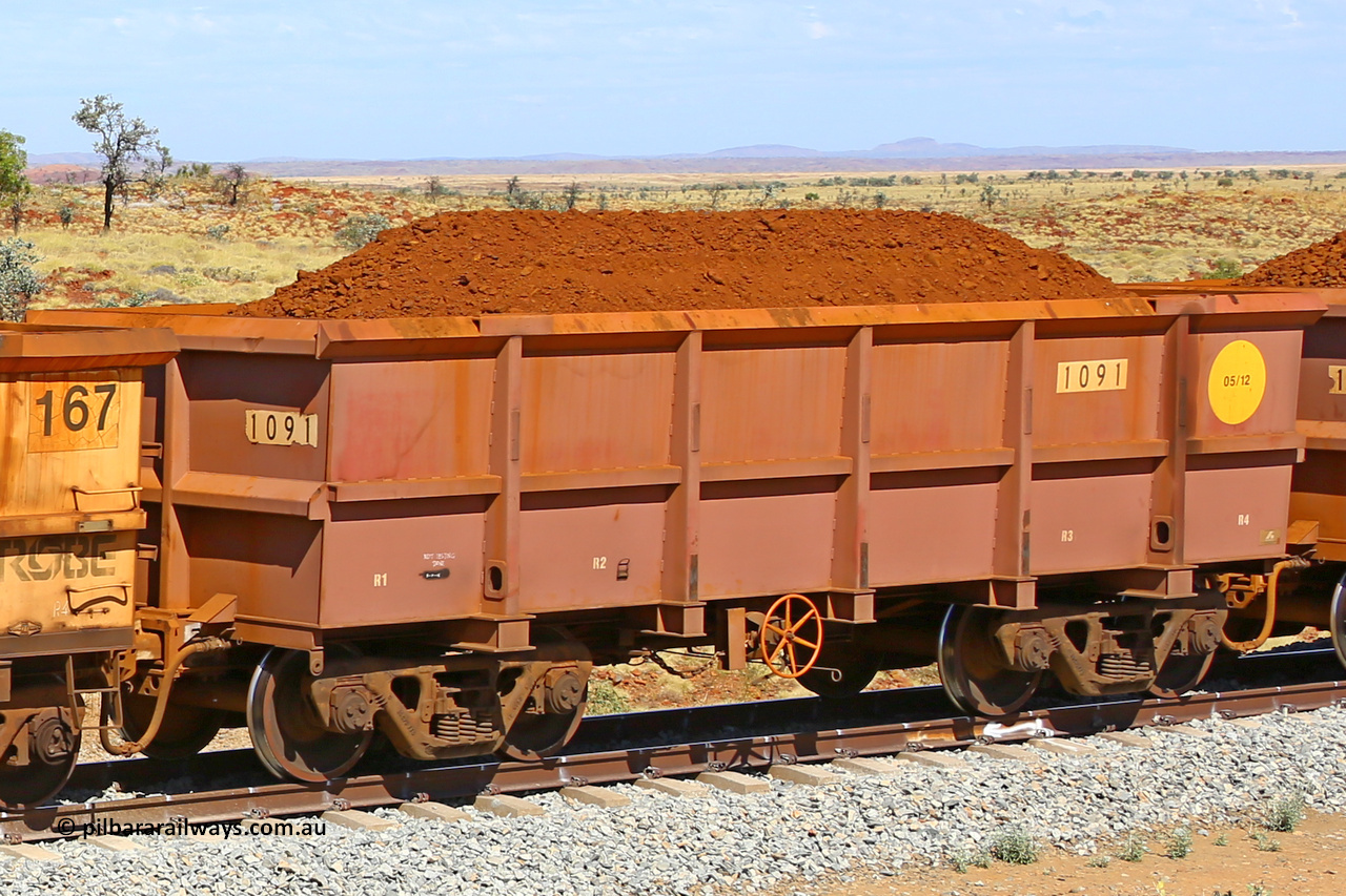 1091 170729 0214
Robe River ore waggon 1091, built by Bradken Rail Qld in May 2012, fixed coupler handbrake side loaded view at the 103 km, between Maitland Siding and the Fortescue River on the Deepdale line. July 29, 2017.
Keywords: 1091;Bradken-Rail-Qld;Robe-ore-waggon;