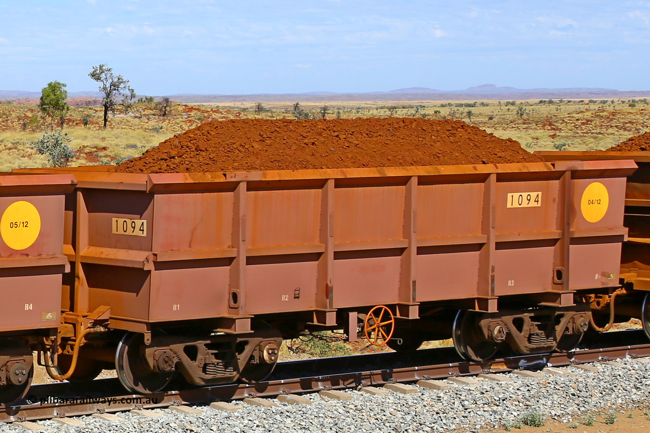 1094 170729 0215
Robe River ore waggon 1094, built by Bradken Rail Qld in April 2012, fixed coupler handbrake side loaded view at the 103 km, between Maitland Siding and the Fortescue River on the Deepdale line. July 29, 2017.
Keywords: 1094;Bradken-Rail-Qld;Robe-ore-waggon;