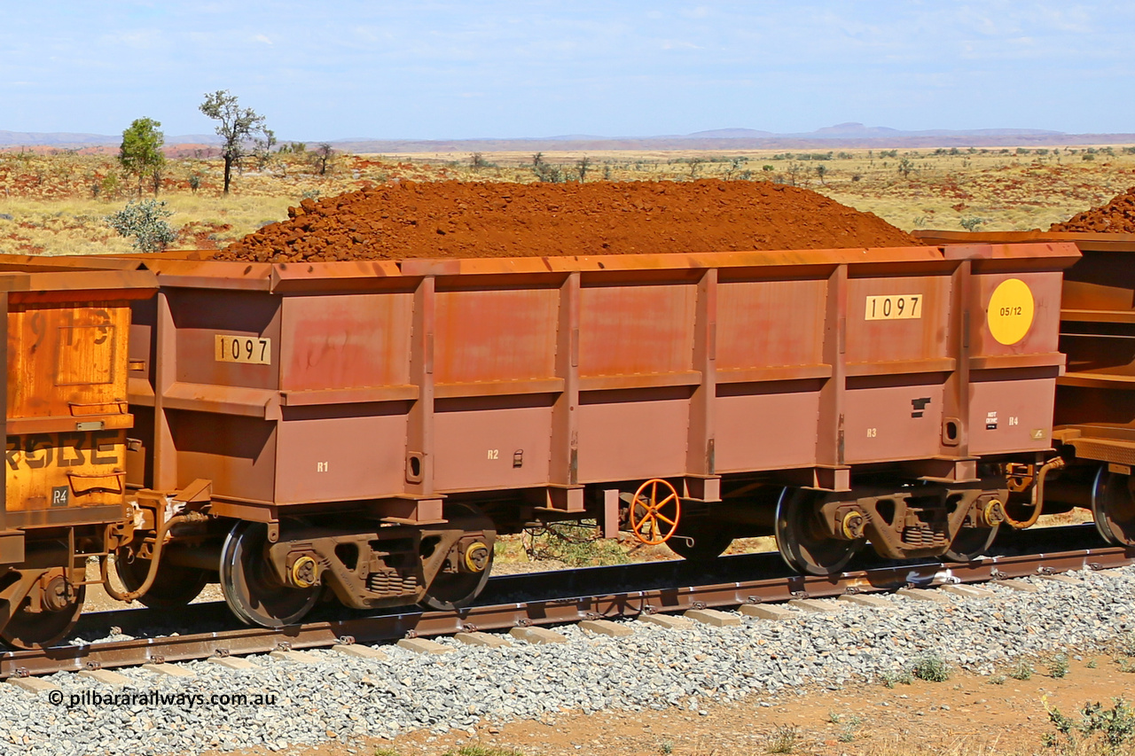 1097 170729 0255
Robe River ore waggon 1097, built by Bradken Rail Qld in May 2012, fixed coupler handbrake side loaded view at the 103 km, between Maitland Siding and the Fortescue River on the Deepdale line. July 29, 2017.
Keywords: 1097;Bradken-Rail-Qld;Robe-ore-waggon;