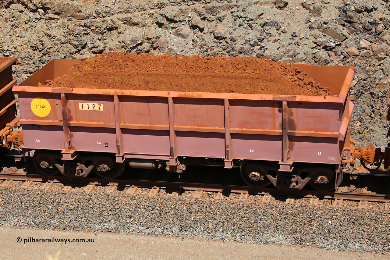1127 160306 1630
Robe River ore waggon 1127, built by Bradken Rail Qld in March 2012, fixed coupler non-handbrake side loaded view, at the 45 km, Harding Siding on the Cape Lambert line. March 6, 2016.
Keywords: 1127;Bradken-Rail-Qld;Robe-ore-waggon;