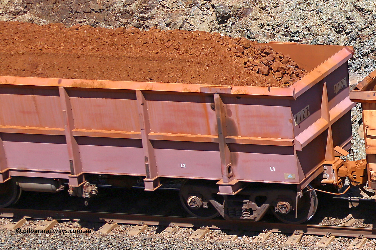 1127 160306 1631
Robe River ore waggon 1127, built by Bradken Rail Qld in March 2012, fixed coupler non-handbrake side loaded detail view of fixed end, at the 45 km, Harding Siding on the Cape Lambert line. March 6, 2016.
Keywords: 1127;Bradken-Rail-Qld;Robe-ore-waggon;