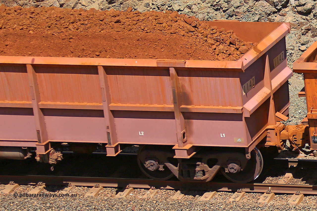 1142 160306 1605
Robe River ore waggon 1142, built by Bradken Rail Qld in April 2012, fixed coupler non-handbrake side loaded detail view of fixed coupler end, at the 45 km, Harding Siding on the Cape Lambert line. March 6, 2016.
Keywords: 1142;Bradken-Rail-Qld;Robe-ore-waggon;